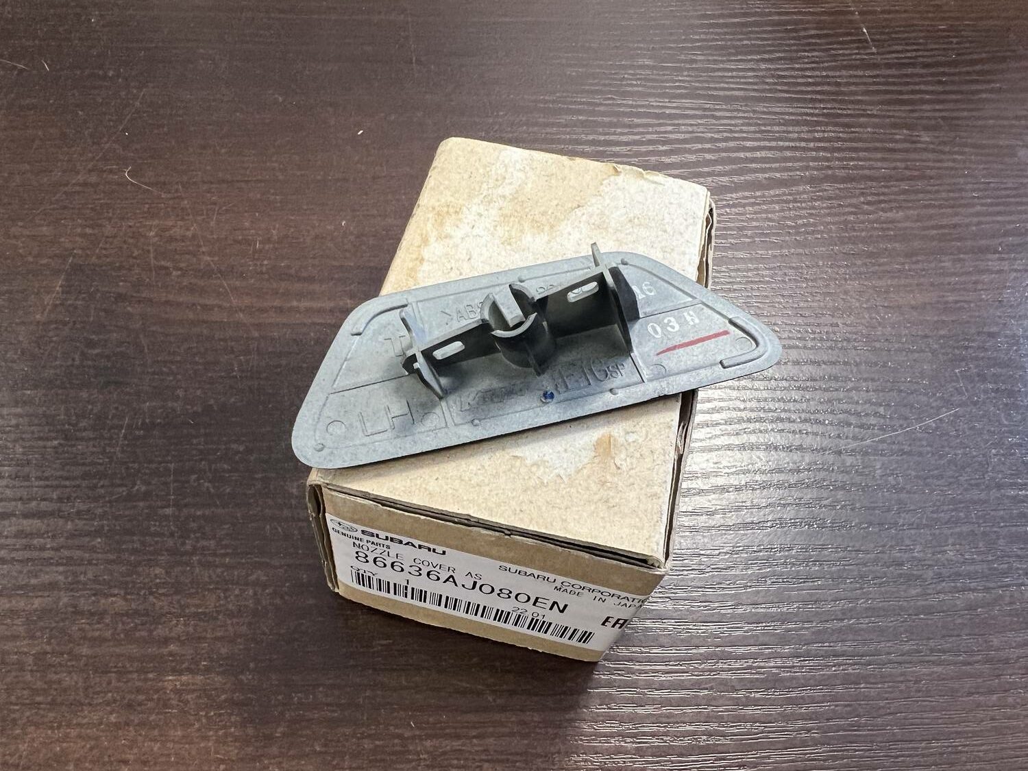 Lukturu mazgātāja sprauslas vāks priekš SUBARU LEGACY 2010 3 Lukturu mazgātāja sprauslas vāks priekš SUBARU LEGACY 2010