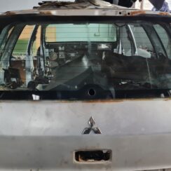 Aizmugures stikls priekš MITSUBISHI LANCER 2006