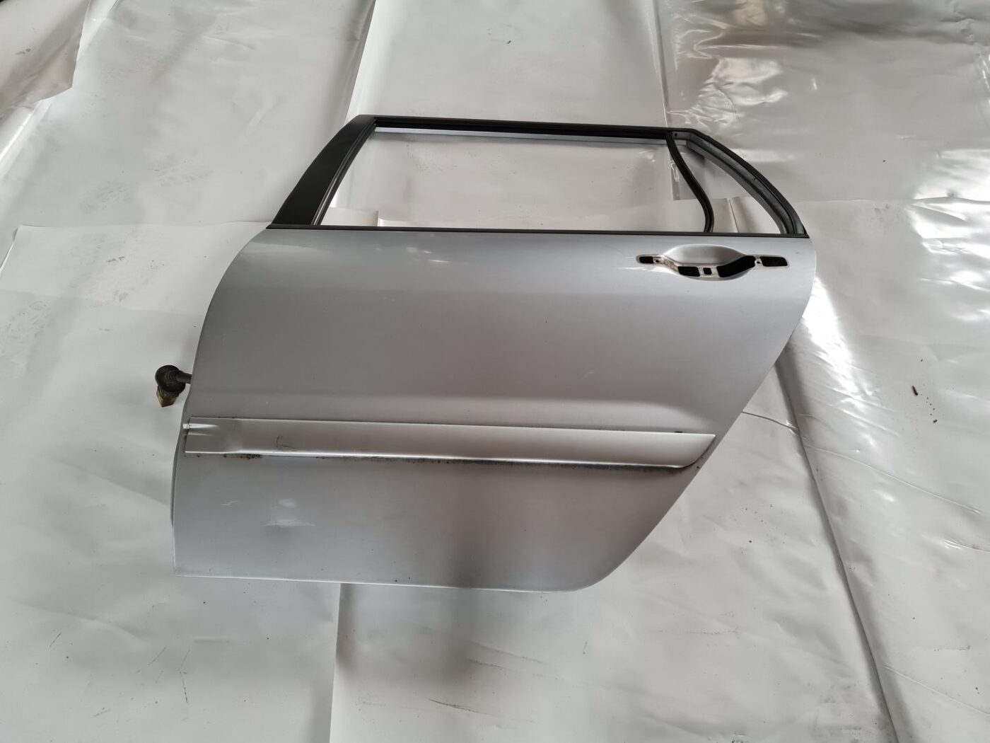 Aizmugurējās kreisās durvis priekš MITSUBISHI LANCER 2006 1 Aizmugurējās kreisās durvis priekš MITSUBISHI LANCER 2006